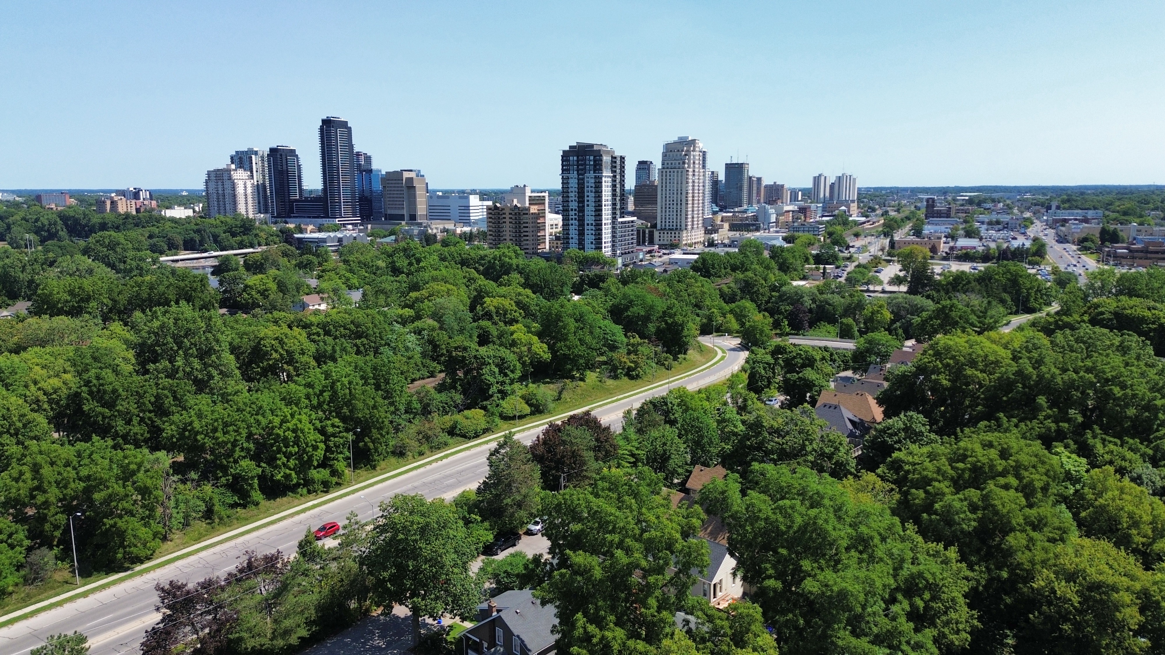 Downtown London Ontario skyline seen over the tree canopy of Old South, a ten-minute walk from 41 Victor Street